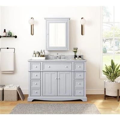 Tocador de baño independiente con lavabo individual en gris con tapa de granito gris